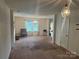 Spacious carpeted living room with good natural light at 3627 Alexander Forest Dr, Charlotte, NC 28269