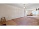 Spacious living room with carpeted and tiled flooring at 3627 Alexander Forest Dr, Charlotte, NC 28269