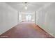 Spacious living room with large windows and carpeted flooring at 3627 Alexander Forest Dr, Charlotte, NC 28269