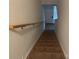 Carpeted staircase with wooden handrail provides access to the upper level at 3627 Alexander Forest Dr, Charlotte, NC 28269