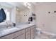 Modern bathroom featuring double sinks, granite countertops, and a walk-in shower at 4017 Avis Way, Monroe, NC 28110