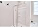 Modern bathroom showcasing a glass-enclosed shower with built-in shelves and fixtures at 4017 Avis Way, Monroe, NC 28110