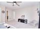 Spacious bedroom with carpeted floors, ceiling fan, soft grey walls, and natural light at 4017 Avis Way, Monroe, NC 28110