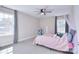 Charming bedroom featuring a ceiling fan and two large windows for natural light at 4017 Avis Way, Monroe, NC 28110