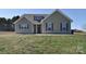 Charming single-Gathering home with neutral siding, a dormer, and well-maintained lawn at 4017 Avis Way, Monroe, NC 28110