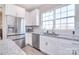 Bright kitchen featuring granite counters, subway tile backsplash, and stainless steel appliances at 4017 Avis Way, Monroe, NC 28110