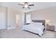 Serene main bedroom with soft carpet, neutral tones, and a glimpse into the ensuite bathroom at 4017 Avis Way, Monroe, NC 28110