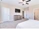 Comfortable main bedroom showcasing a dresser with a TV, ensuite access, and ample closet space at 4017 Avis Way, Monroe, NC 28110