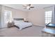 Spacious main bedroom featuring plush carpet, large windows, and stylish bedside tables at 4017 Avis Way, Monroe, NC 28110