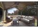 Covered outdoor patio area featuring neutral toned patio furniture and ample space for outdoor living and entertaining at 4017 Avis Way, Monroe, NC 28110