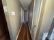 Hallway with hardwood floors and access to rooms at 409 S Martin Luther King Jr Ave, Salisbury, NC 28144