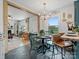 Open-concept dining and living area, featuring a cozy fireplace and plenty of natural light at 5622 S Rocky River Rd, Monroe, NC 28112