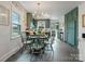 Inviting dining area with teal accents, and natural light from the adjacent windows at 5622 S Rocky River Rd, Monroe, NC 28112