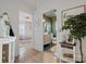 A hallway featuring views into the bathroom and bedroom, enhancing the home's open and inviting layout at 5622 S Rocky River Rd, Monroe, NC 28112
