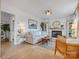 Inviting living room features a white brick fireplace, hardwood floors, and neutral décor at 5622 S Rocky River Rd, Monroe, NC 28112