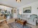 Cozy living room showcases hardwood floors and an open view into the kitchen at 5622 S Rocky River Rd, Monroe, NC 28112