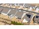 Aerial view of homes with well-manicured lawns, backyards, and a patio with outdoor seating at 7336 Overjoyed Xing, Charlotte, NC 28215