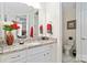 Well-lit bathroom featuring granite counters, a toilet room, and ample counter space, combining comfort and convenience at 7336 Overjoyed Xing, Charlotte, NC 28215