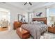 Comfortable bedroom with a wooden furniture set, carpeted floors, and a ceiling fan for a relaxing atmosphere at 7336 Overjoyed Xing, Charlotte, NC 28215