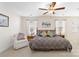 Bright, carpeted primary bedroom with a ceiling fan, neutral walls and furniture at 7336 Overjoyed Xing, Charlotte, NC 28215