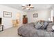 Comfortable primary bedroom with neutral walls, carpet, ceiling fan and access to a private bath at 7336 Overjoyed Xing, Charlotte, NC 28215