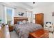 Serene bedroom with a large bed, tray ceiling, and ample natural light, offering a comfortable and restful retreat at 7336 Overjoyed Xing, Charlotte, NC 28215