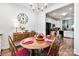 Dining area view with a wood table, chandelier, and a glimpse into the adjacent kitchen at 7336 Overjoyed Xing, Charlotte, NC 28215