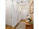 Inviting hallway with wood floors, neutral walls, a decorative rug and light fixtures at 7336 Overjoyed Xing, Charlotte, NC 28215