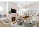 Comfortable living room with a fireplace, neutral colors, and an open layout, ideal for relaxation and gatherings at 7336 Overjoyed Xing, Charlotte, NC 28215