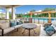 Community outdoor lounge area with comfortable seating adjacent to the pool at 7336 Overjoyed Xing, Charlotte, NC 28215