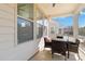 Covered patio with a seating area, perfect for enjoying the outdoors in any weather at 7336 Overjoyed Xing, Charlotte, NC 28215