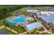 Aerial view showcasing a resort-style pool, clubhouse, and surrounding landscape at 7336 Overjoyed Xing, Charlotte, NC 28215