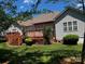 Expansive backyard features a raised wooden deck, manicured lawn, mature trees, and privacy at 7700 Sedgebrook E Dr, Stanley, NC 28164