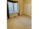 Bedroom with carpet, window with curtains, and double door closet at 7700 Sedgebrook E Dr, Stanley, NC 28164