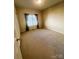 Bedroom featuring neutral carpeting, a window with blinds, and simple decor at 7700 Sedgebrook E Dr, Stanley, NC 28164
