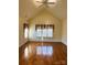 Spacious bedroom with wood floors, vaulted ceilings, and large windows with curtains at 7700 Sedgebrook E Dr, Stanley, NC 28164