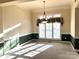 Bright dining room with ample natural light from the large window and neutral wall paint at 7700 Sedgebrook E Dr, Stanley, NC 28164