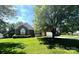 Beautiful brick home with well-maintained lawn, mature trees, and an attached two car garage at 7700 Sedgebrook E Dr, Stanley, NC 28164