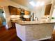Beautiful kitchen featuring granite countertops, stainless steel appliances, and wooden cabinetry at 7700 Sedgebrook E Dr, Stanley, NC 28164