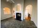 Bright living room with a fireplace and archways leading to other rooms at 7700 Sedgebrook E Dr, Stanley, NC 28164