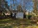 Backyard shed with fresh paint and room for additional storage at 7700 Sedgebrook E Dr, Stanley, NC 28164