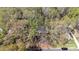 Aerial view of a home with mature trees and landscaped grounds providing shade and character to the property at 800 River Oaks Ln, Charlotte, NC 28226