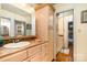 Well-lit bathroom features ample counter space, storage, and a large mirror at 800 River Oaks Ln, Charlotte, NC 28226