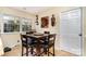 Cozy dining area features a square table, leather chairs, and a decorative wine rack at 800 River Oaks Ln, Charlotte, NC 28226