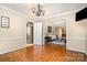 This dining room features parquet flooring and a doorway into the adjacent living room at 800 River Oaks Ln, Charlotte, NC 28226