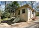 The exterior of the home features white brick and a small patio area with steps at 800 River Oaks Ln, Charlotte, NC 28226