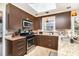 Well-lit kitchen features granite countertops, stainless appliances, and custom cabinetry at 800 River Oaks Ln, Charlotte, NC 28226