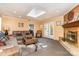 Cozy living room featuring a brick fireplace, built-in shelving, comfortable seating, and French doors leading to the outside at 800 River Oaks Ln, Charlotte, NC 28226