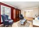 Inviting living room featuring a classic rug, stylish armchairs, and wooden storage at 800 River Oaks Ln, Charlotte, NC 28226
