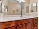 Bathroom showcasing a wooden vanity cabinet with a sink, bright lighting, and a large mirror at 808 Wynnshire Dr # A, Hickory, NC 28601